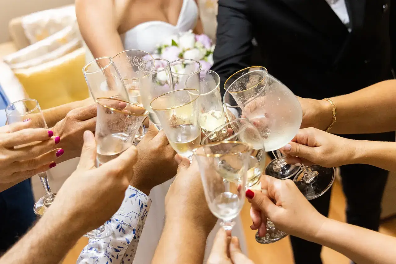 A group of people toasting champagne glasses at a wedding in Cincinnati, Ohio.