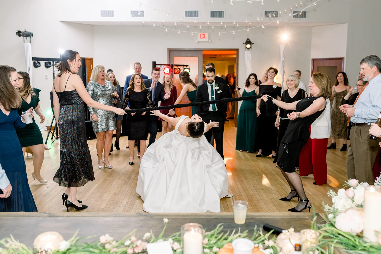 Cincinnati Wedding DJs cutting a ribbon at a wedding reception.