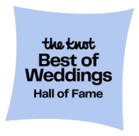 tk-hof-badge The Knot Best of Weddings Hall of Fame emblem on a light blue background.