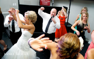 DJ "Big Daddy" Allen Walker leads a wedding reception dance floor.
